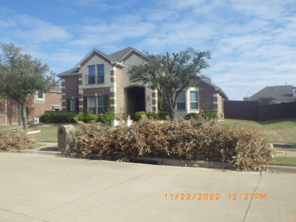 Trash Piled outside of Home